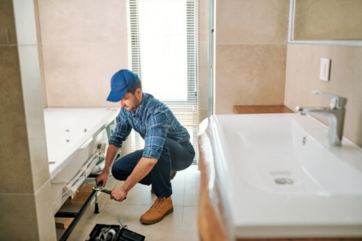 An electrician doing bathroom renovation